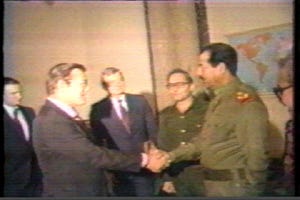 Hussein and Donald Rumsfeld shake hands Hussein and Donald Rumsfeld shake hands