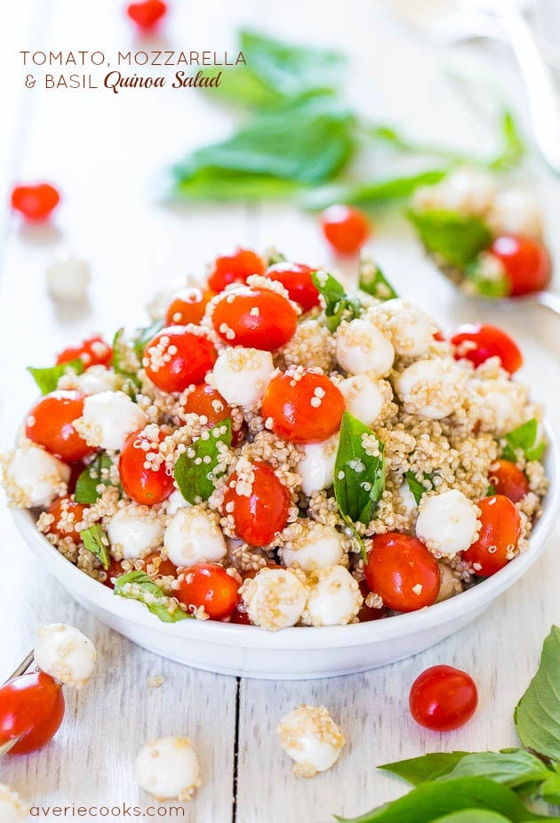Tomato, Mozzarella & Basil Quinoa Salad in a white bowl. Tomato, Mozzarella & Basil Quinoa Salad in a white bowl.