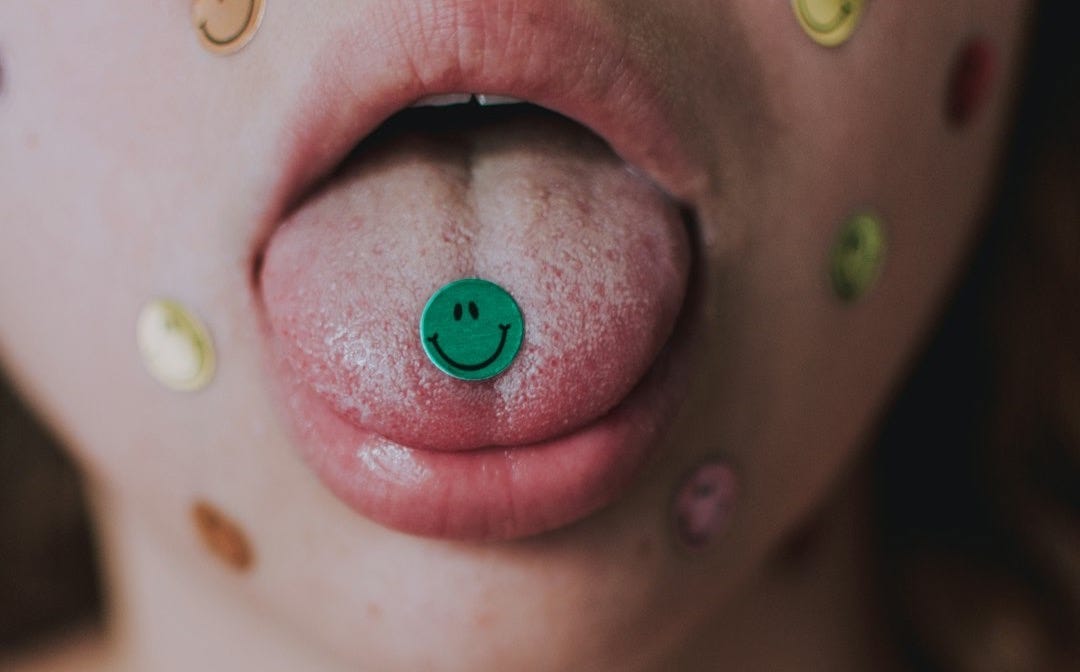 person with pink and green lip stick