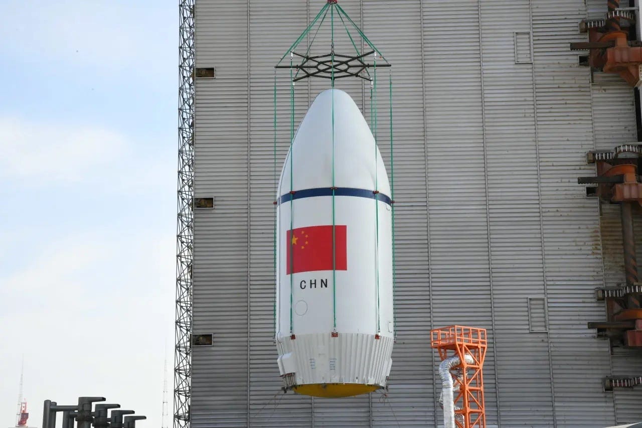 The Long March 6A Y28 vehicle’s fairing with Yaogan-50-02 inside is being lifted onto Launch Complex 9A for integration.