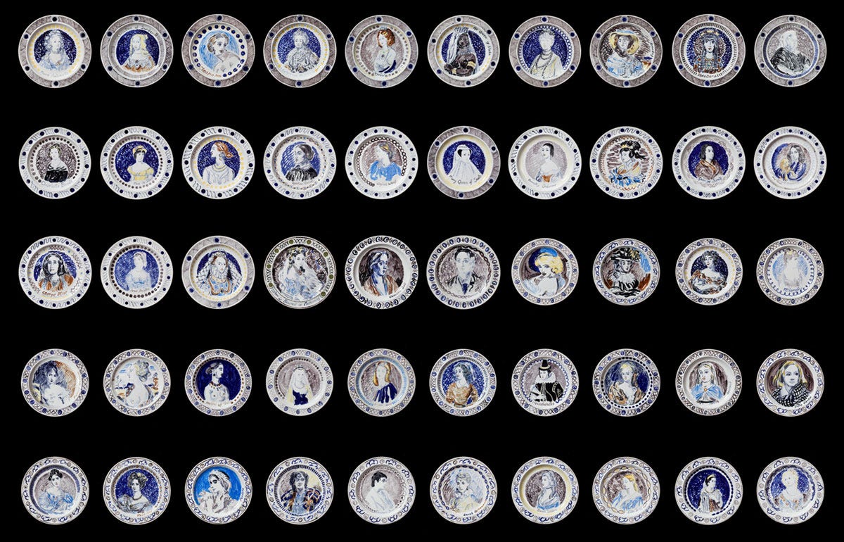 50 painted plates arranged in five rows on a black background 50 painted plates arranged in five rows on a black background