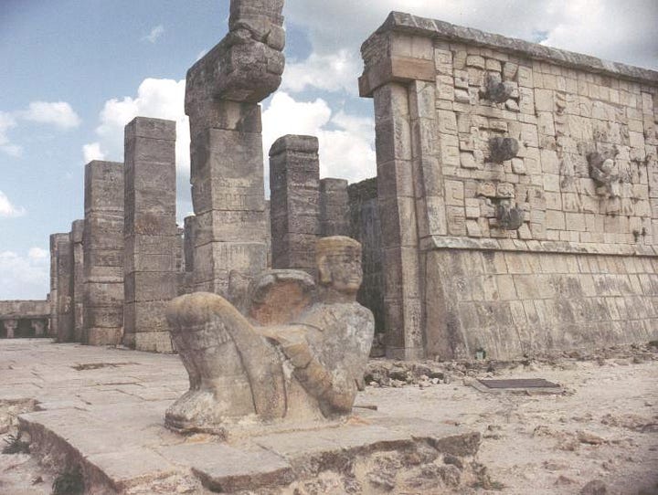 a chac mool and serpent columns on top of the Temple of the Warriors