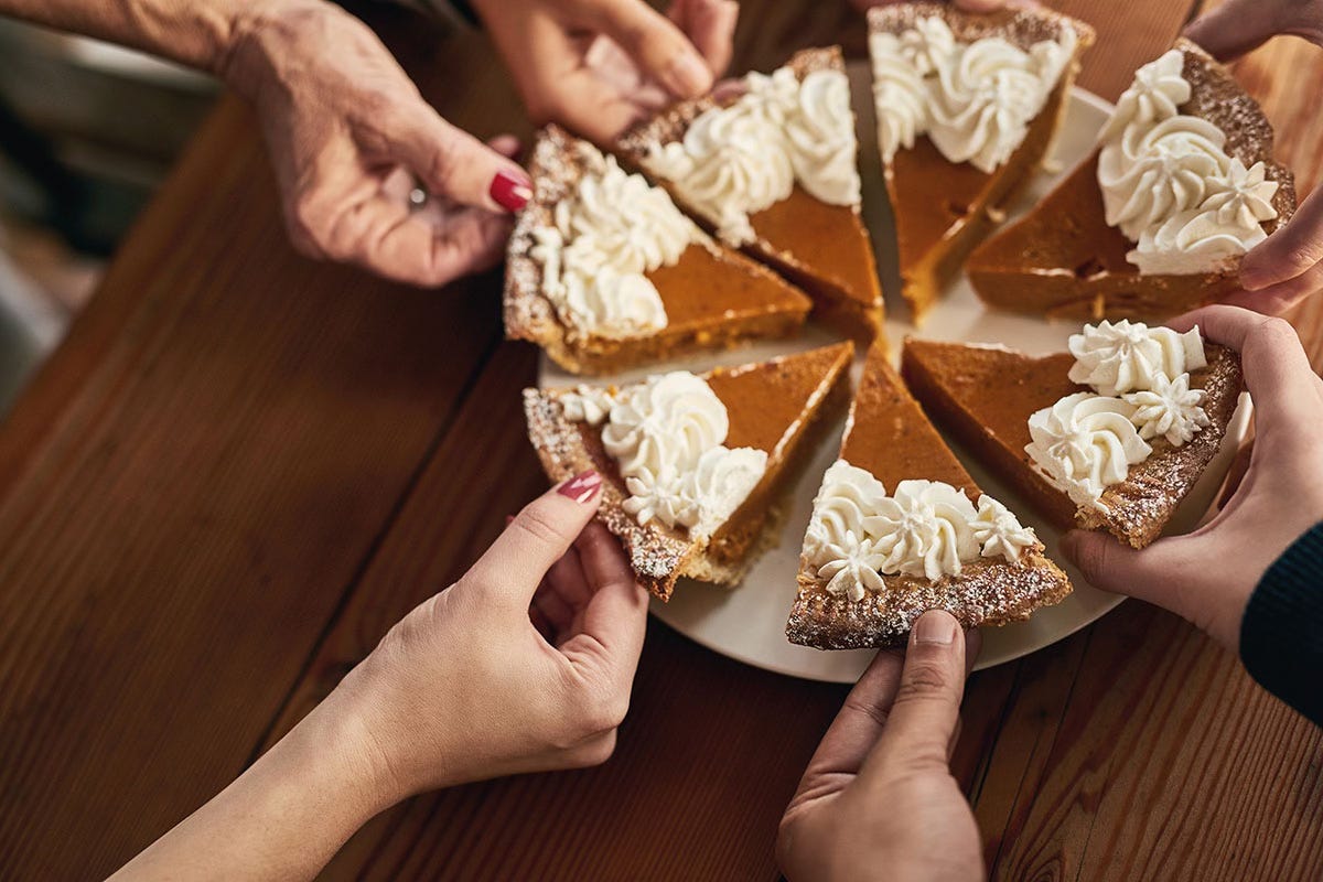 Hands grabbing slices of pie