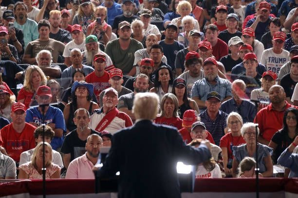 Supporters listen to Republican presidential nominee, former U.S. President Donald Trump speak at a rally on July 31, 2024 in Harrisburg,...