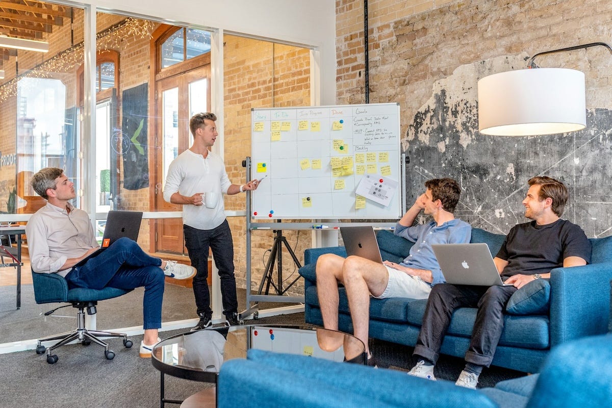 A B2B marketing professional actively listening to a client during a strategic meeting, demonstrating a genuine, customer-centric partnership. A B2B marketing professional actively listening to a client during a strategic meeting, demonstrating a genuine, customer-centric partnership.