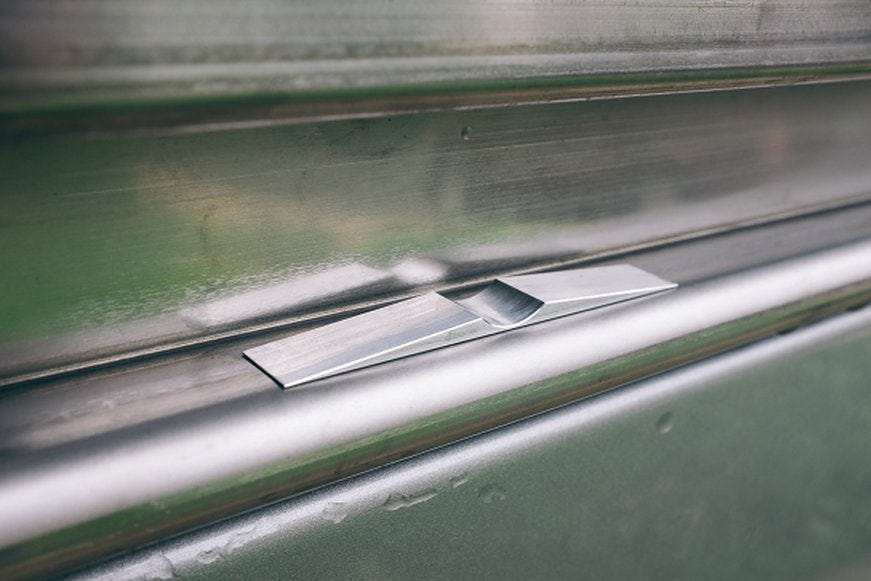 The door stop installed on the van rail slide.