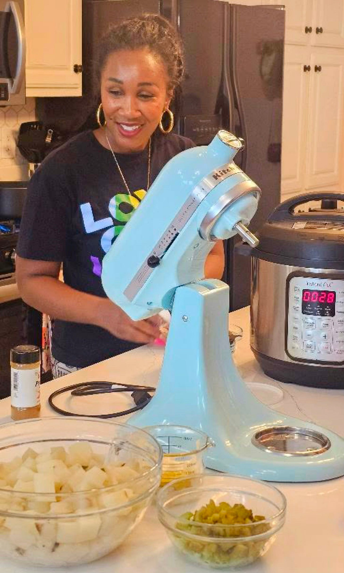 Shaunda Necole preparing a modern soul food recipe in a home kitchen using a stand mixer and Instant Pot, demonstrating how Black culinary traditions evolve with modern cooking tools