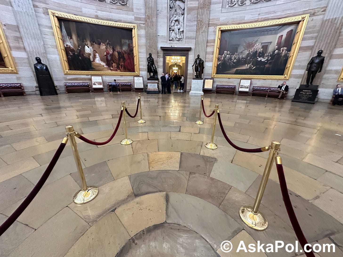 Ropes line middle of marble floor in rotunda with bronze statues. Photo: Matt Laslo © www.askapoldrugs.com 