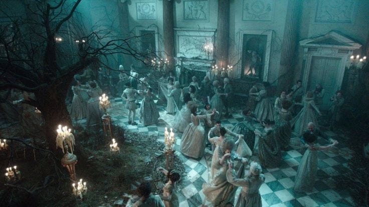 This may contain: a group of people dressed in white and black are standing around the room, surrounded by candles