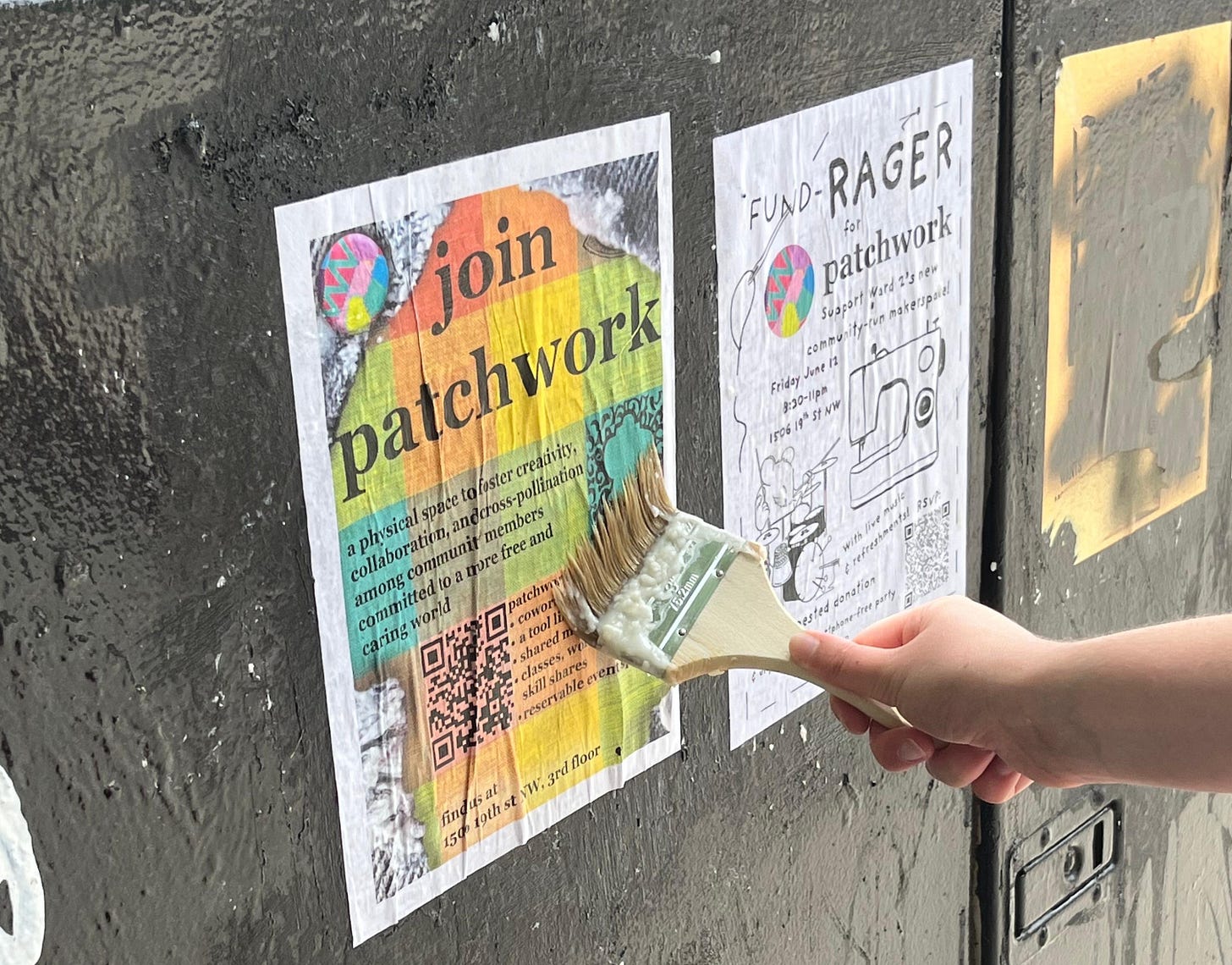 Image shows a flyer being wheat pasted with a hand holding a wooden handled brush up to a black painted surface. The flyer reads join patchwork in large font on a background with pale rainbow toned squares. Another flyer can be seen advertising the fund-rager primarily in black and white. Image shows a flyer being wheat pasted with a hand holding a wooden handled brush up to a black painted surface. The flyer reads join patchwork in large font on a background with pale rainbow toned squares. Another flyer can be seen advertising the fund-rager primarily in black and white.