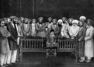 The 7-year-old Aga Khan III (1877 - 1957) at his enthronement ceremony as Imam of the Shia Ismaili Muslims in Bombay, 1st September 1885. He is surrounded by community elders and seated on the oblong wooden throne of imamate. (Photo by Keystone/Hulton Archive/Getty Images) The 7-year-old Aga Khan III (1877 - 1957) at his enthronement ceremony as Imam of the Shia Ismaili Muslims in Bombay, 1st September 1885. He is surrounded by community elders and seated on the oblong wooden throne of imamate. (Photo by Keystone/Hulton Archive/Getty Images)