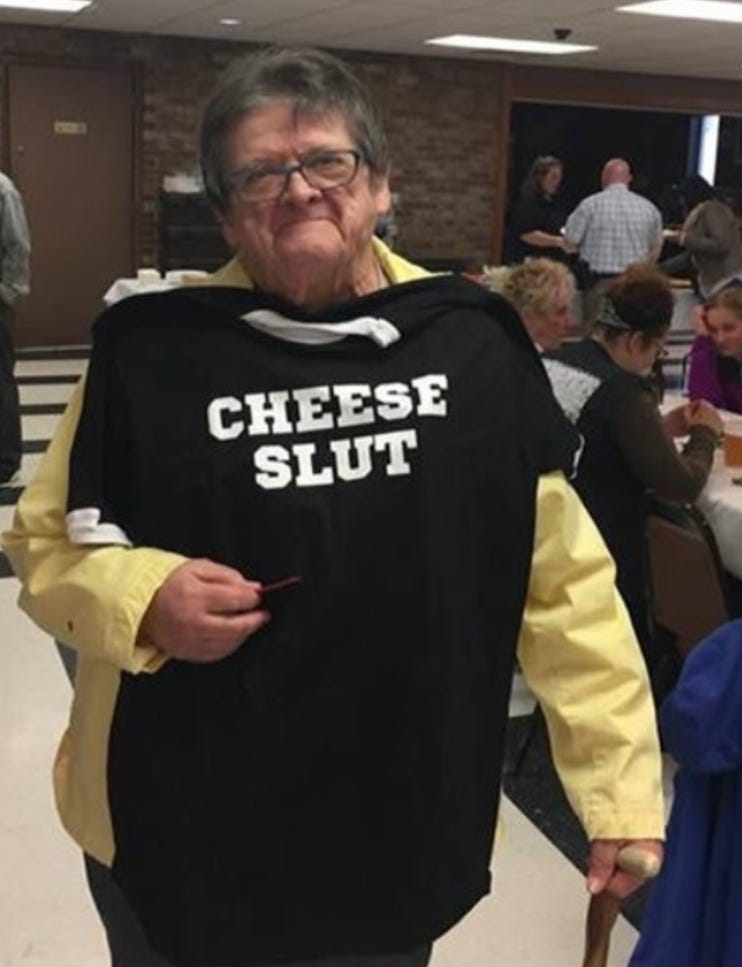 an older woman wearing shirt that says "cheese slut" an older woman wearing shirt that says "cheese slut"