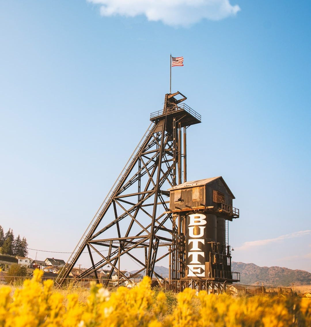 a tall tower with a flag on top of it