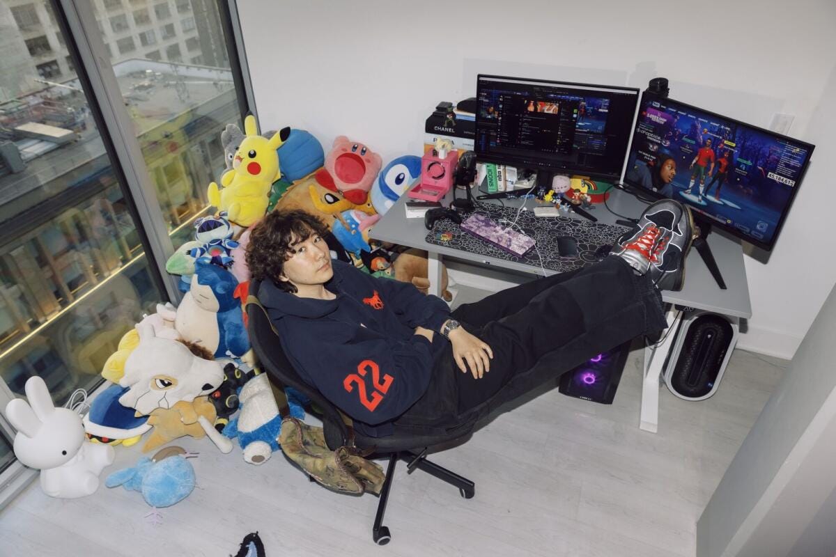 Anthony Fujiwara sits with his feet on a desk.