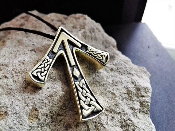 norse tiwaz rune jewelry in gold and black