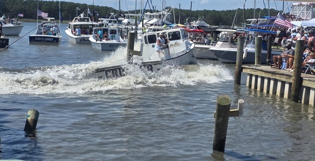 Captain Derrick Hoy swings Crusher into reverse during the boat-docking contest.