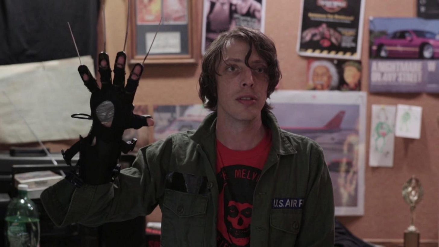 Buzzard | Still features a man wielding a Freddy Krueger-esque glove.