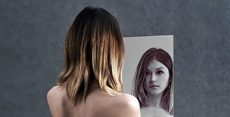 A young girl looking in the mirror. A young girl looking in the mirror.