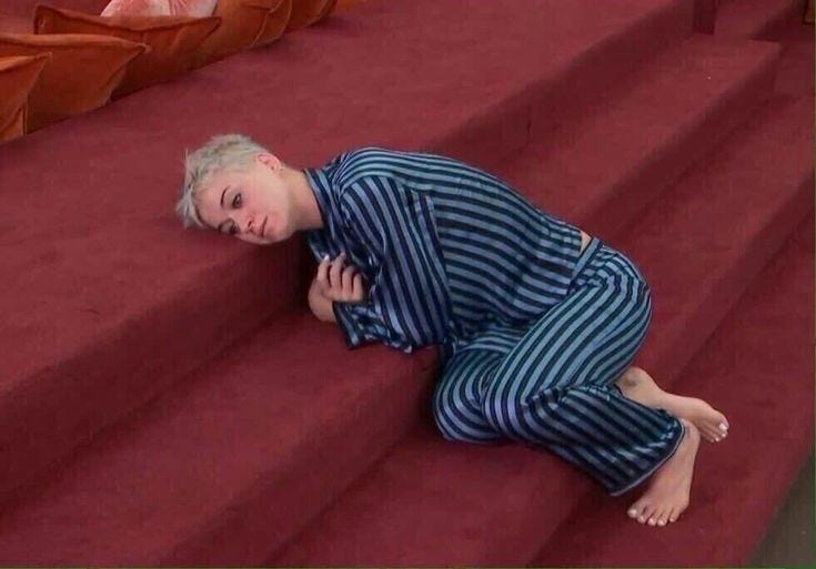 This may contain: a little boy laying on the steps in pajamas