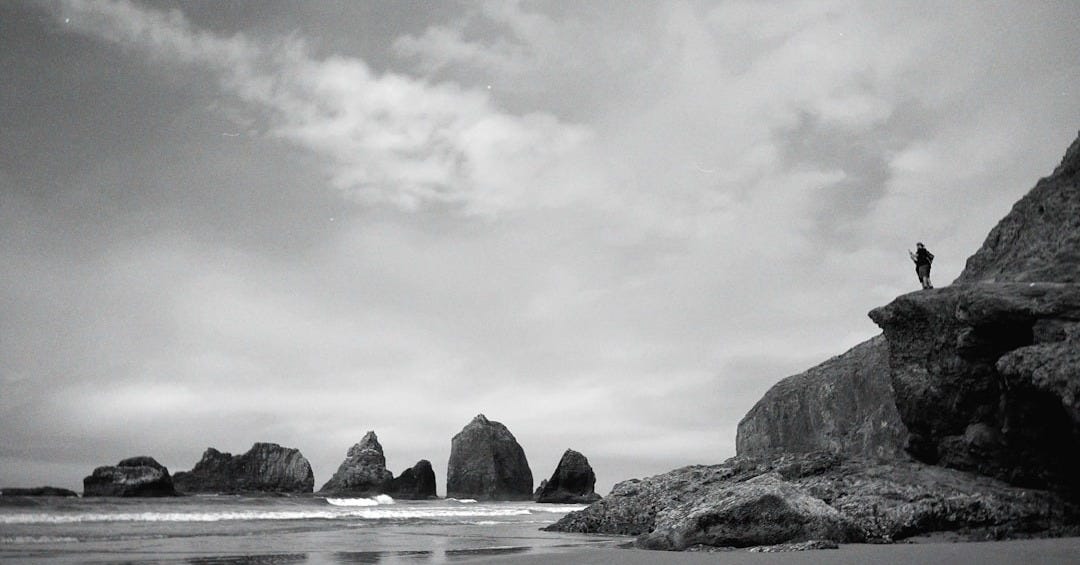 a person standing on a rock