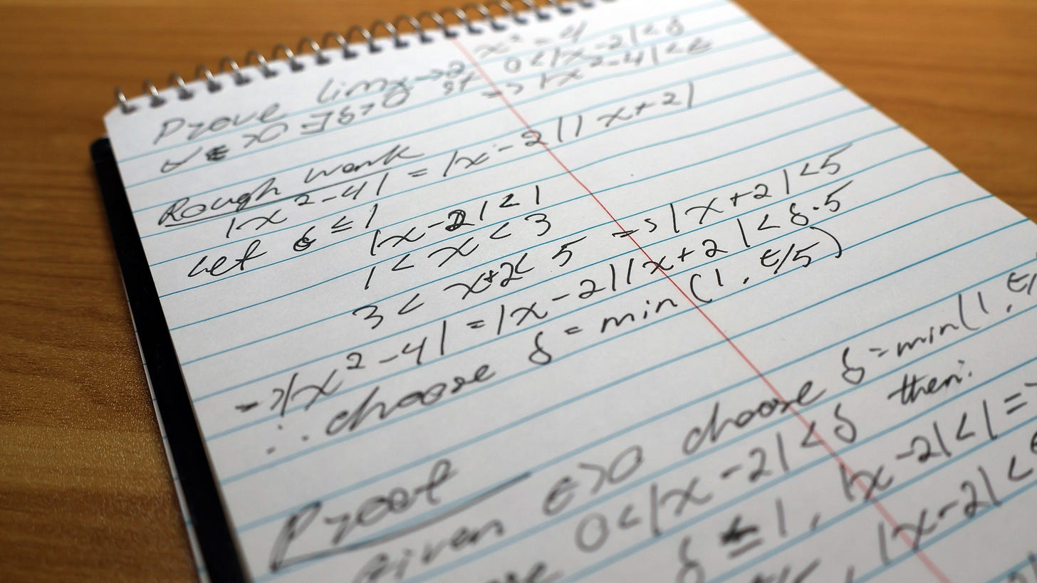 Handwritten epsilon-delta proof for lim x→2 of x² = 4