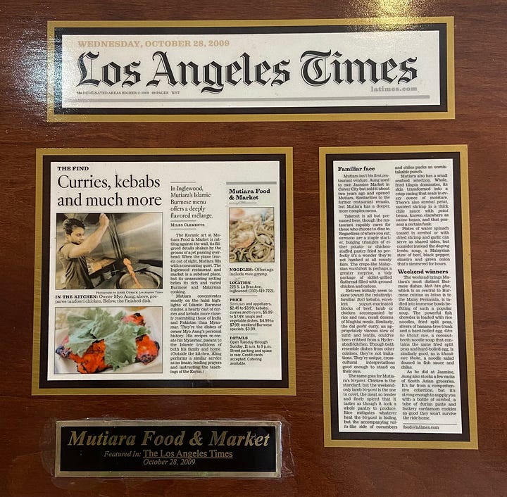 Photos of the LA Times articles posted onto cherry wood plaques. 