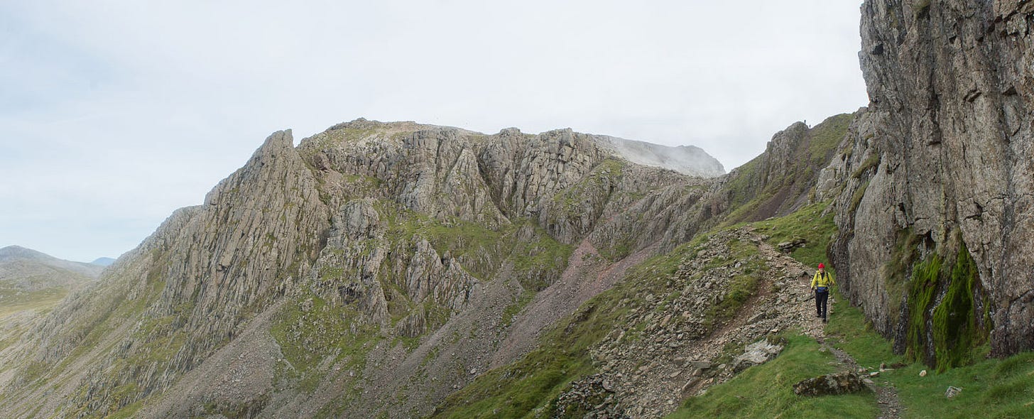 rocky hill, path and cliff on right