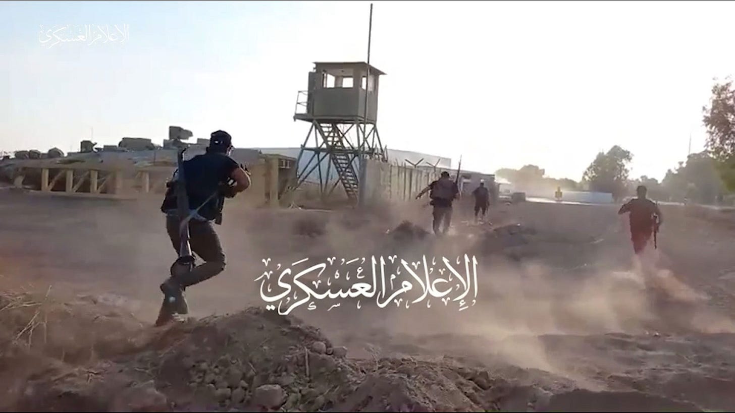 A still from a video released by Hamas shows militants advancing on an Israeli military base just outside of Nahal Oz, Israel, on October 7. A still from a video released by Hamas shows militants advancing on an Israeli military base just outside of Nahal Oz, Israel, on October 7.