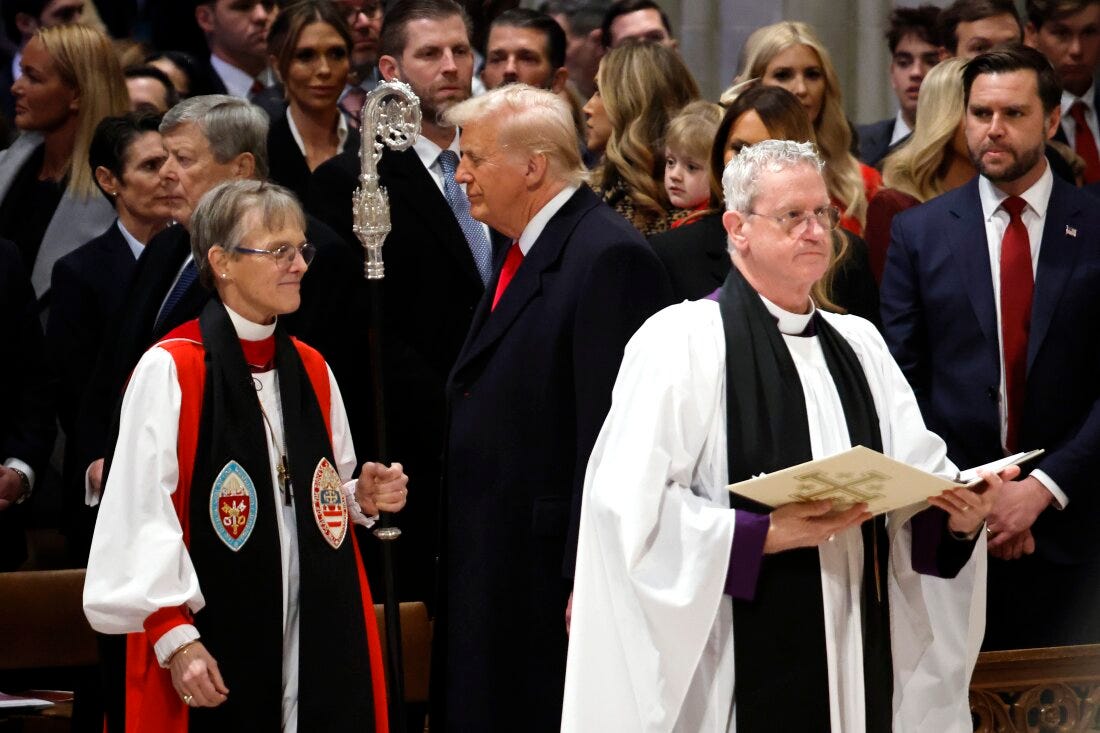 Bishop Mariann Edgar Budde, wearing a white and red robe and black stole, holds a crozier as she passes President Donald Trump and Vice President J.D. Vance.