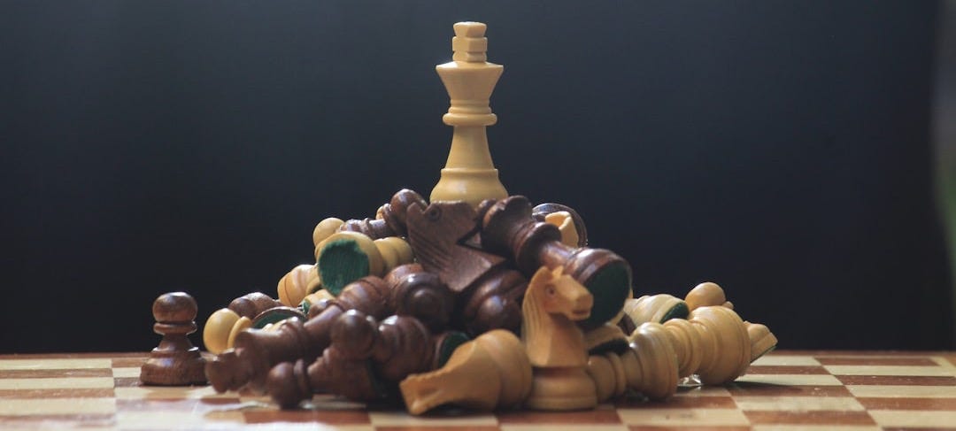 A chess board with pieces of chess on it A chess board with pieces of chess on it