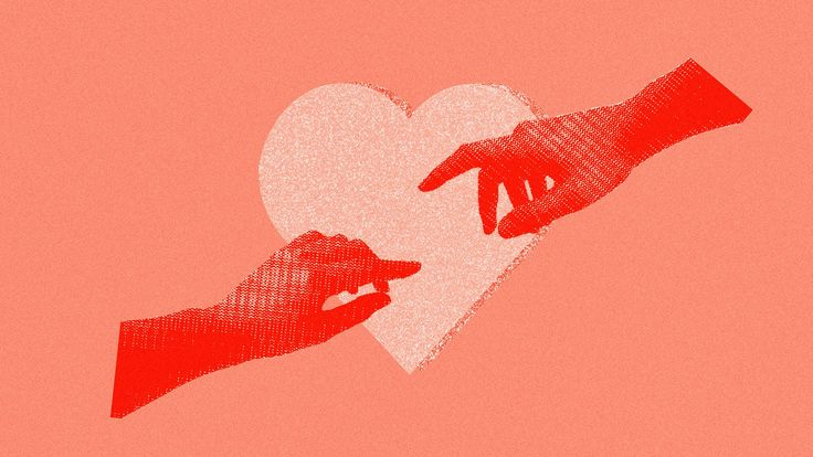 This may contain: two hands touching each other over a heart