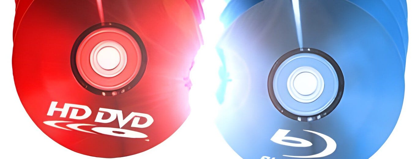 Blu-ray vs HD DVD discs representing historical format wars, similar to the current GPU vs TPU discussion in AI hardware.