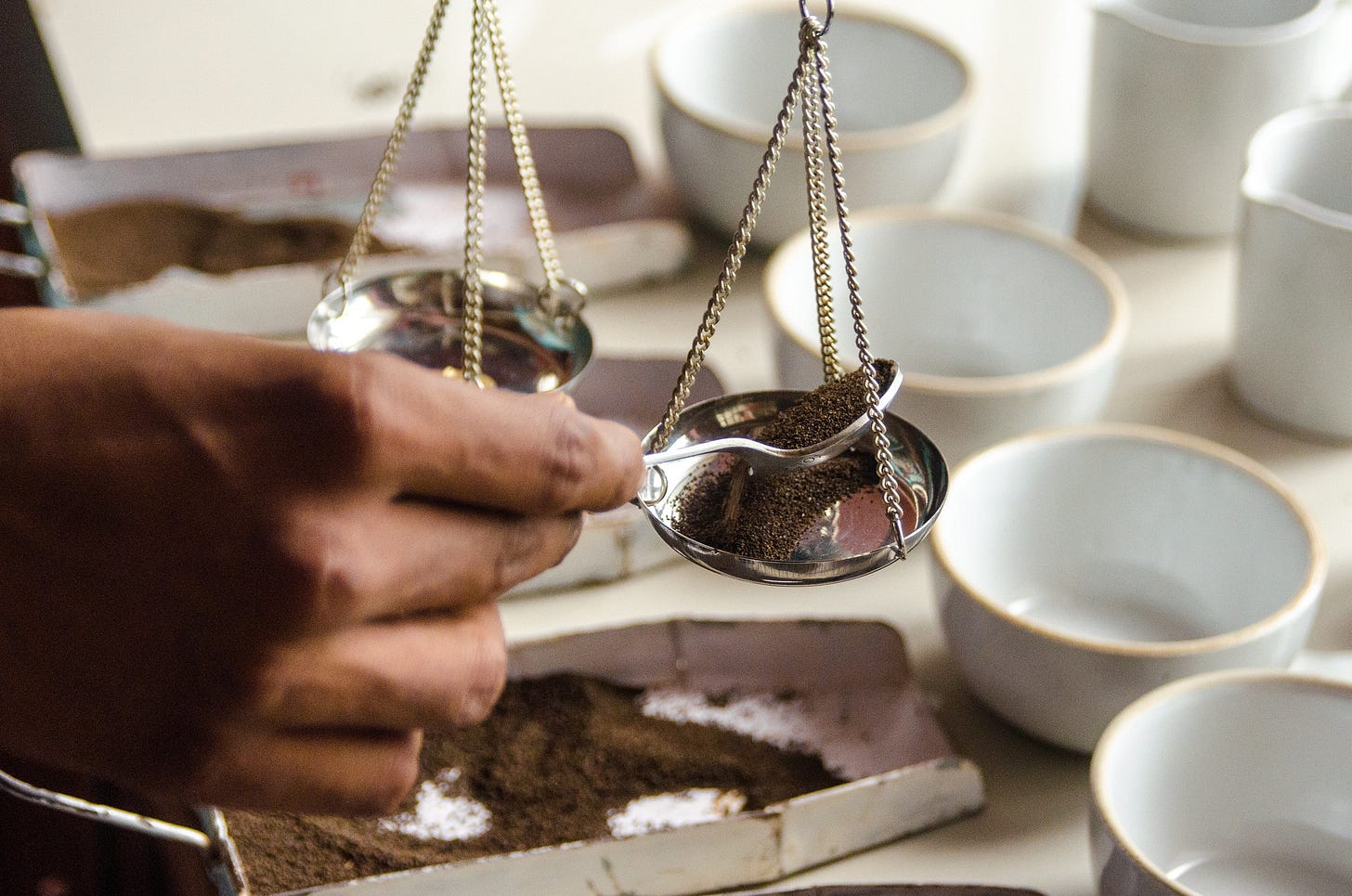 ID: Weighing tea dust on a scale