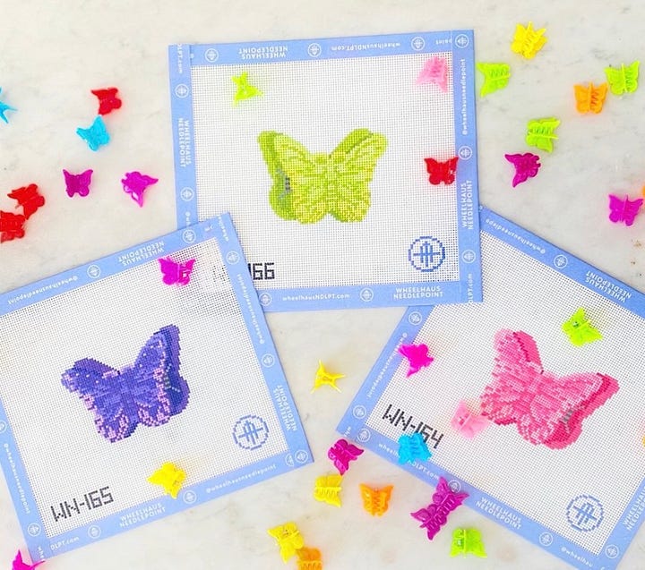 needlepoint canvases of boat and tote, sour dough starter, slice of cake and butterfly clips