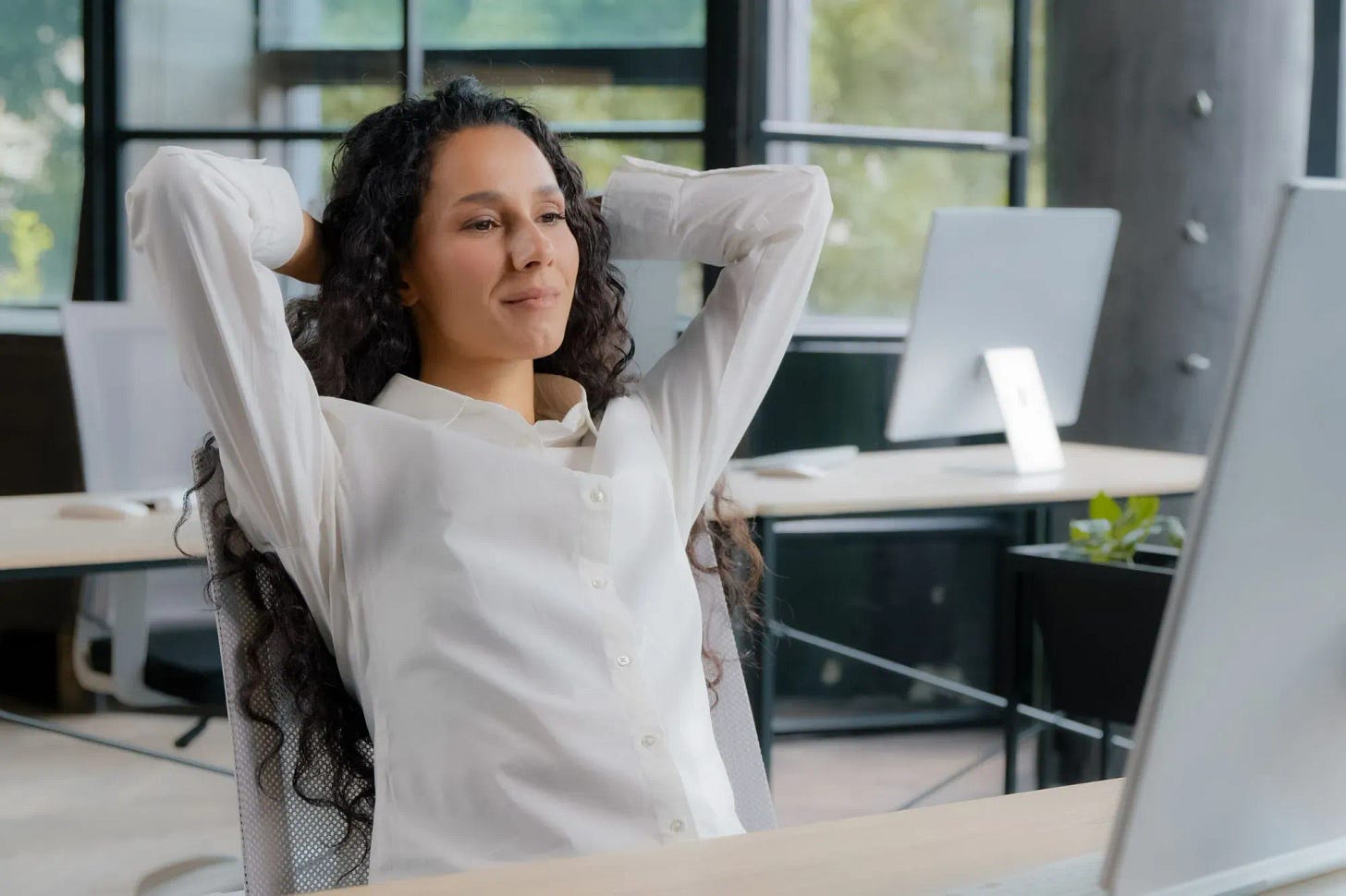 Woman sitting relieved of back pain
