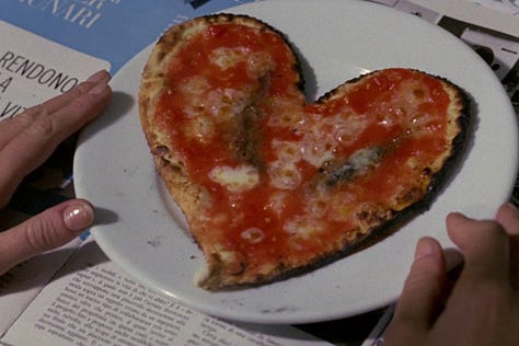 A heart-shaped pizza, as well as scenes in the pizzeria, in A Drama of Jealousy (and Other Things) OR A Pizza Triangle (1970) Italian Film | Film Flavor: A Newsletter Surveying Food in Film
