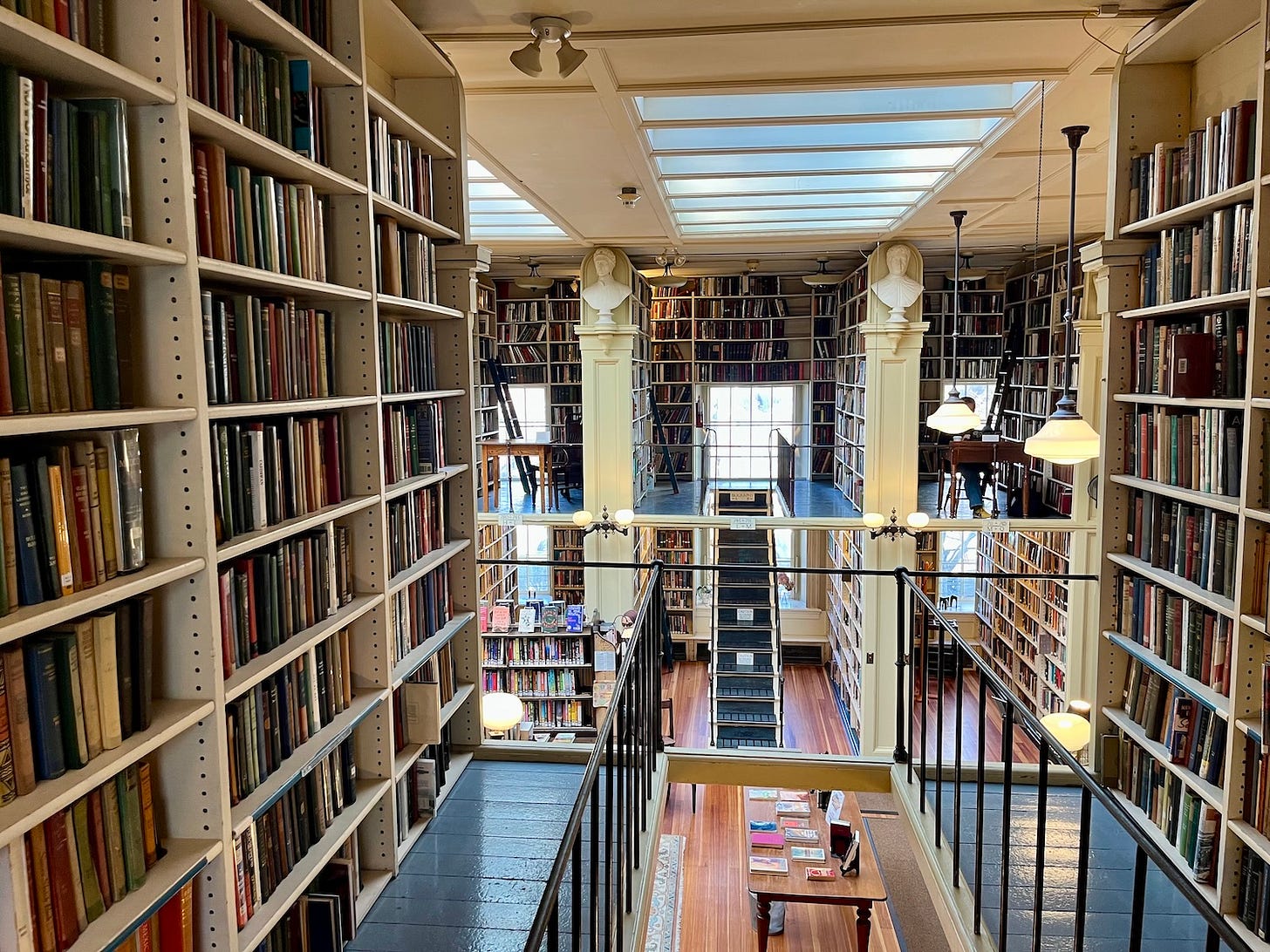 rows and floors of books at a library
