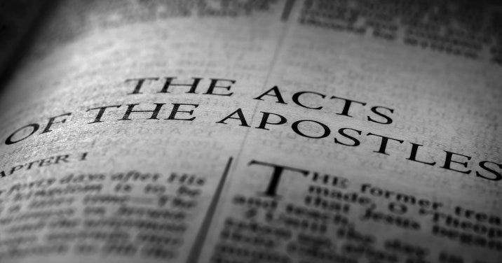A close-up on the header text "The Acts of the Apostles" in a Bible