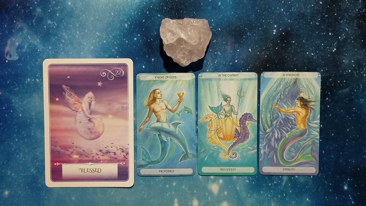 New Moon Pick-a-Card Tarot Reading for May 2025, pile 1 - rose quartz (pink) stone and an oracle card on a starry blue background