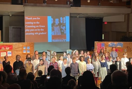 students on stage during a play