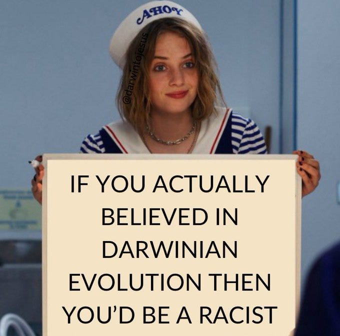 A woman holding a sign which says: "IF YOU ACTUALLY BELIEVED IN DARWINIAN EVOLUTION THEN YOU'D BE A RACIST"