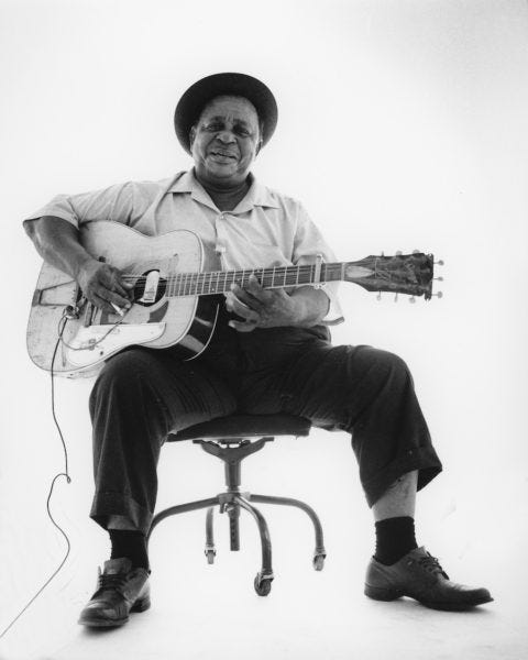 big joe williams holding his nine-string guitar