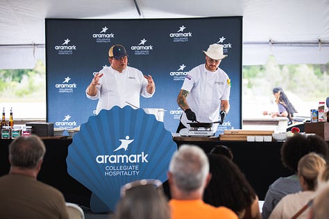“Chefs from Aramark Collegiate Hospitality showcasing coastal-inspired dishes at the NC Seafood Festival 2025 — including seafood risotto, crab gumbo, and fried shrimp tacos — during live cooking demos and tastings with festival guests.”