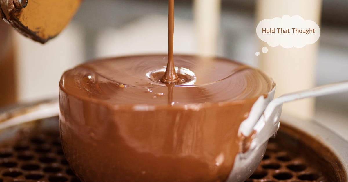 A sausepan overflowing with melted chocolate. A Hold That Thought bubble is in the right corner.