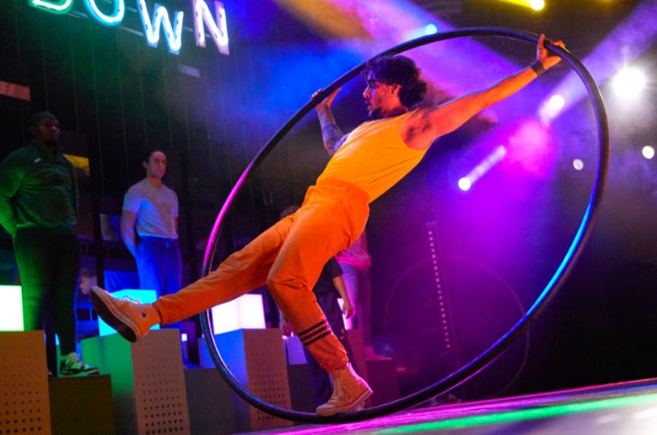 An acrobat performer inside a giant hoop