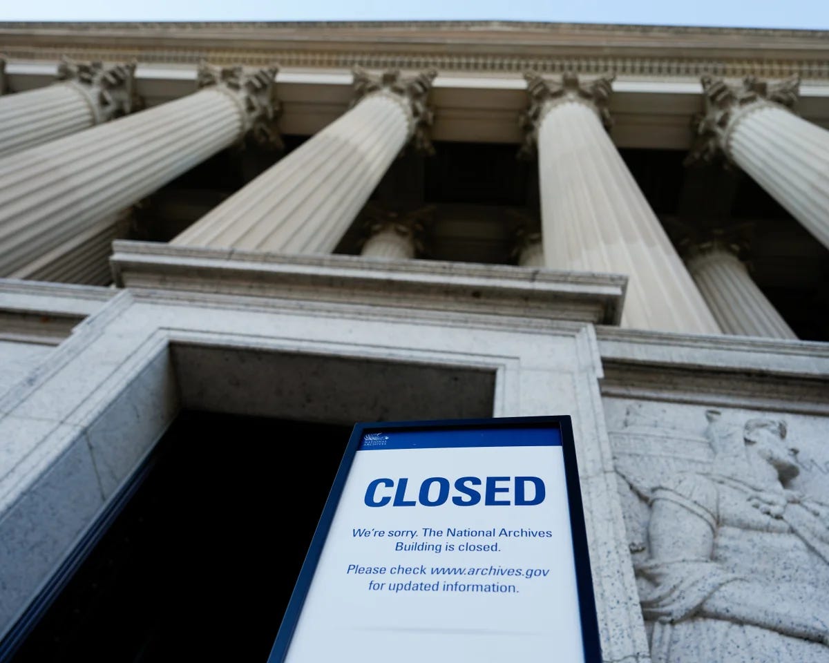 government building with closed sign in front