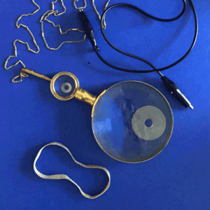 A looping gif made from two frames that features a face made from everyday materials. The expression switches between a surprised face and a frightened face.