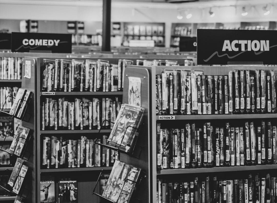 grayscale photo of books on shelves grayscale photo of books on shelves