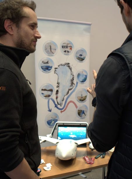 Three photos of people at a stand showcasing a drone. 