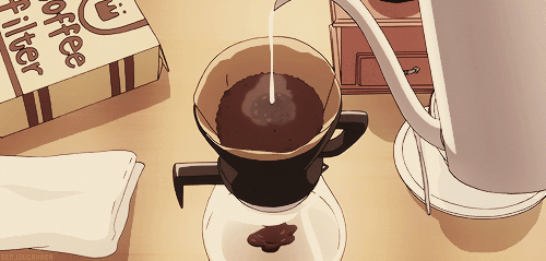 This may contain: there is a coffee pot with liquid in it on the table next to a box
